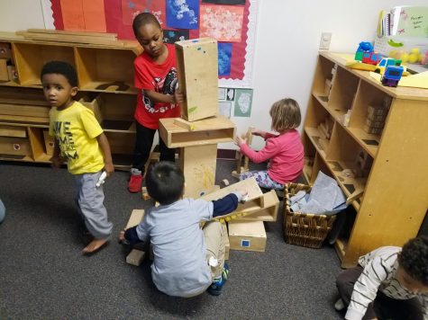 Children build with blocks together in the LLCC Child Development Center.