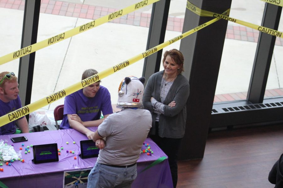 Hyler Pence and Brinton Johnson sit at the table and show off a game they created during  the EndGame Expo, previously called the Video Game Design Tournament, in the A.Lincoln Commons on Thursday, April 25, 2019. The expo hosted teams and the video games they have created in Video Game Design I and Video Game Design II classes. 
