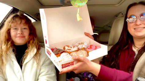 Nadia Giacomini (left) and Carmen Dillman (right) pose with Dunkins 6 new Valentines Day doughnuts.